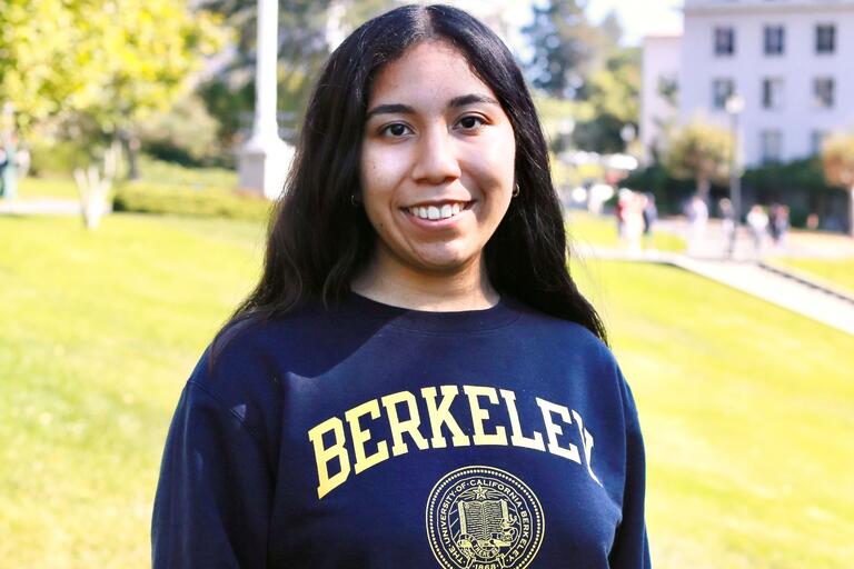 Photo of Alexia Guerra in front of Berkeley campus backdrop
