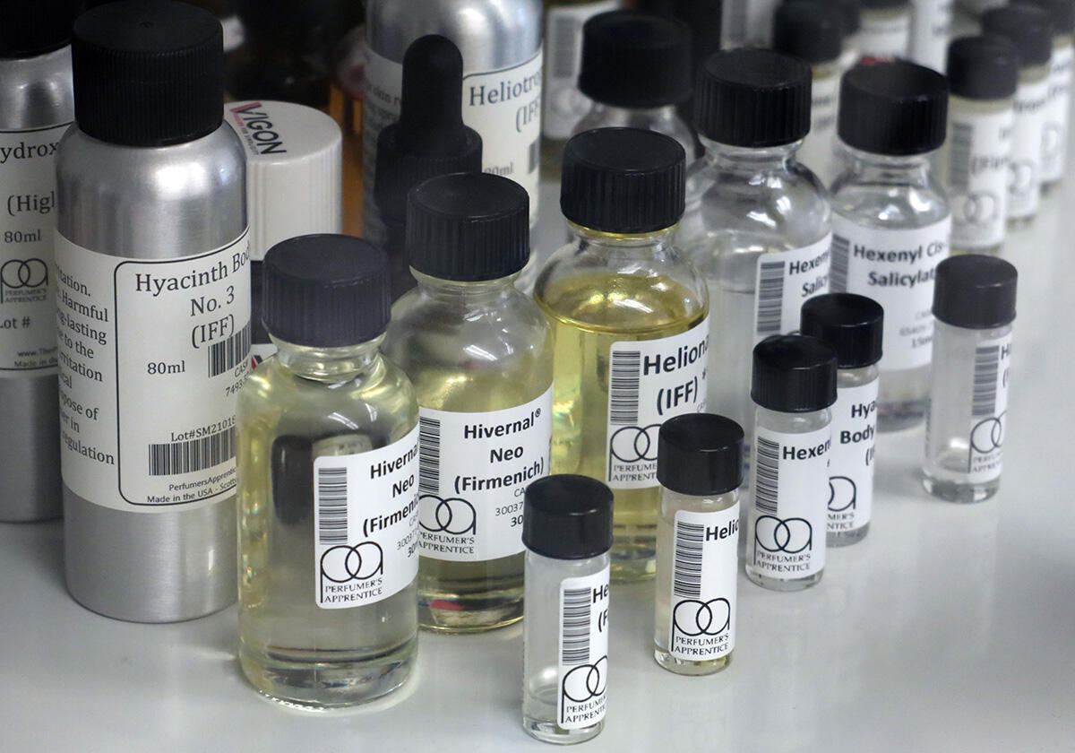 An assortment of clear and opaque bottles on a shelf