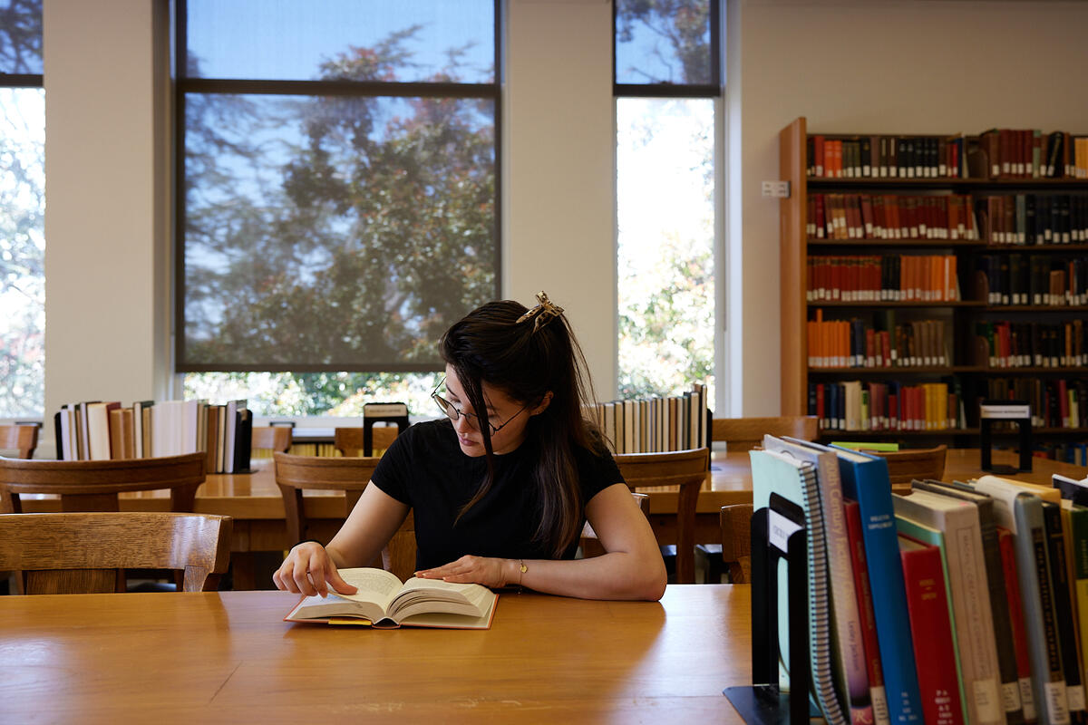 student studying in the library