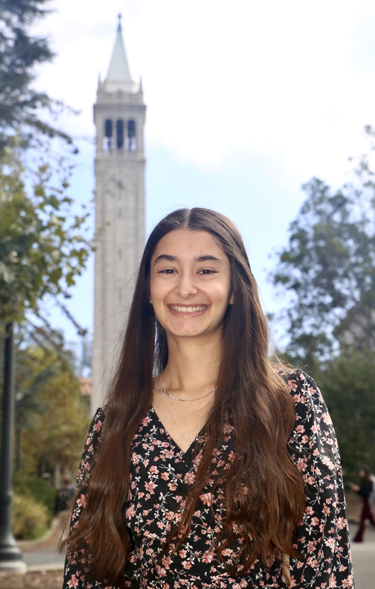 Photo of Fabiola posing in front of the campanile on Berkeley's campus