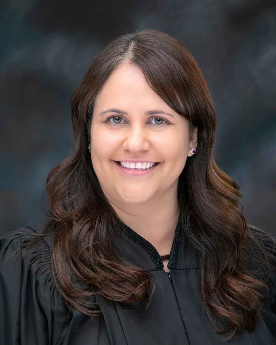 smiling woman in judicial robes
