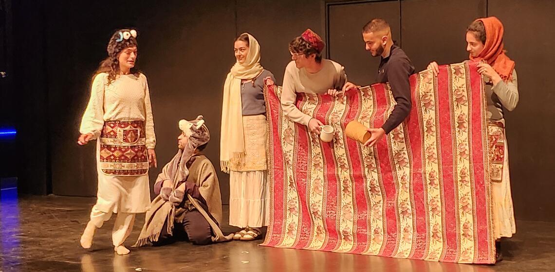 students in Armenian dress performing play