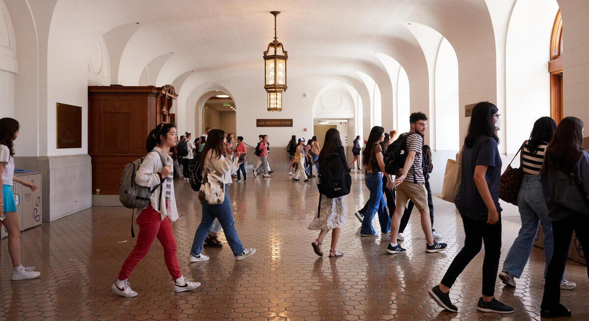Students walk between classes in Wheeler Hall