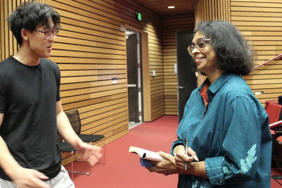 Author Sonali Deraniyagala speaks with student