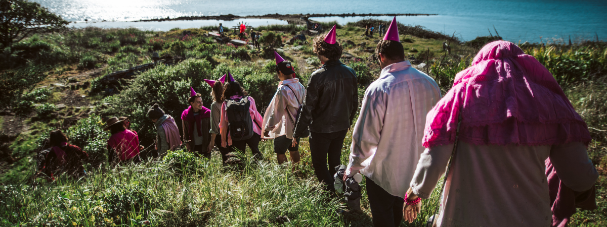 Students walk along the coast during a field trip