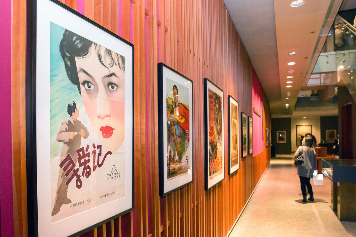 Library hallway with framed vintage East Asian film posters