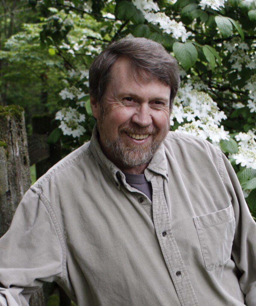 man smiles at camera