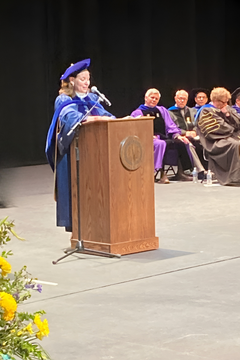 sara guyer speaking at English commencement