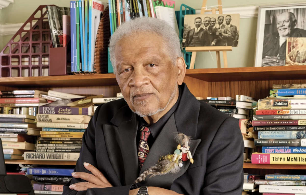 Ishmael Reed with bookshelf in background