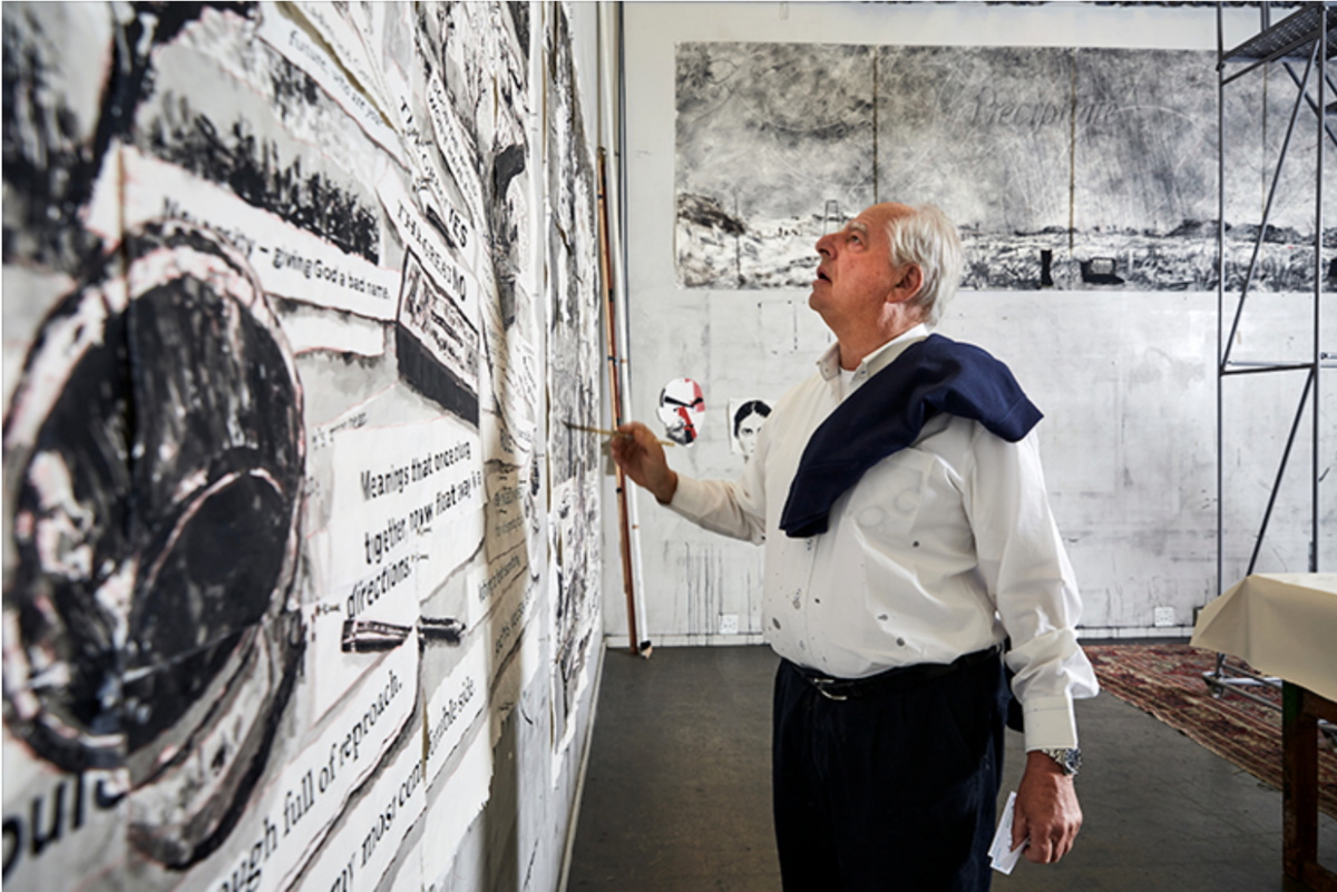 artist william kentridge looking at a wall of his work