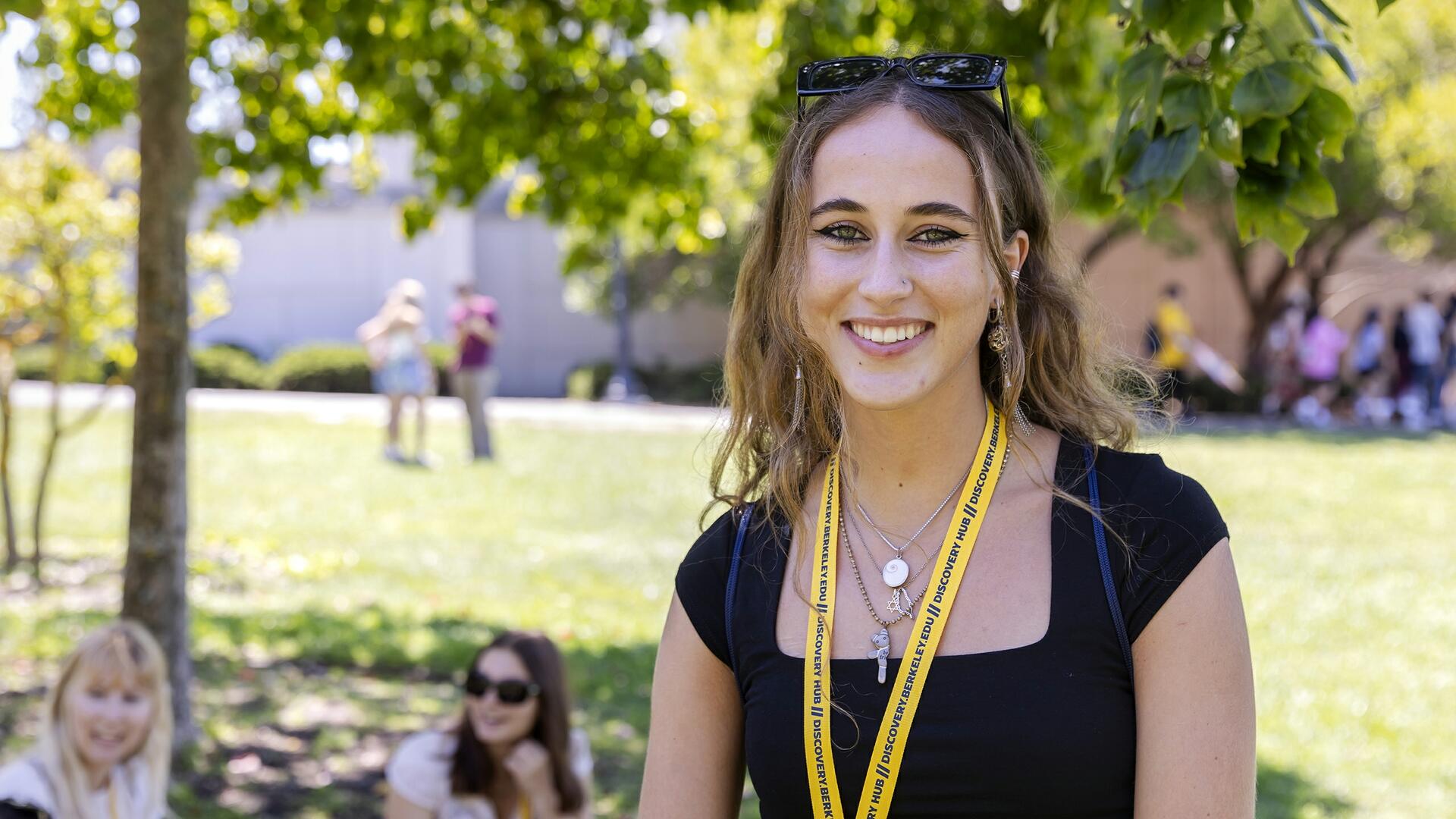 Photo of Esther Cannesson standing beneath a tree on UC Berkeley campus